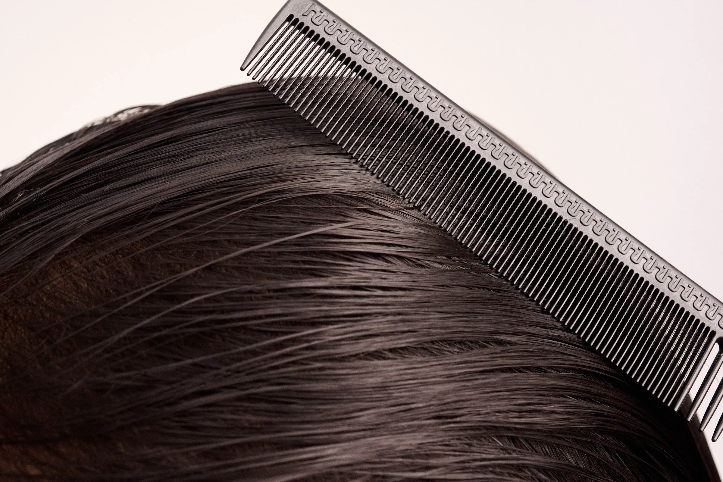 Stylist cutting hair with a Hanzo shear