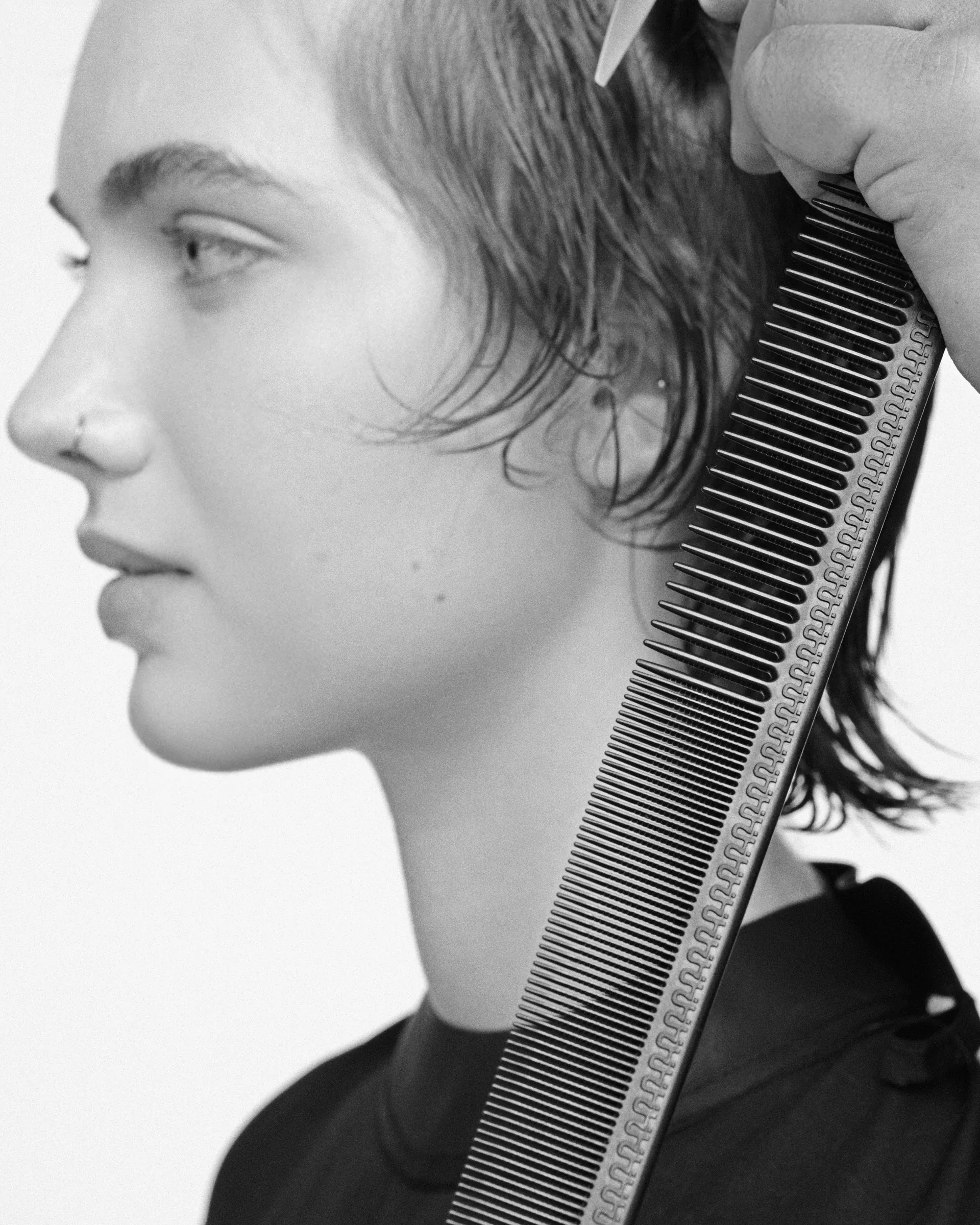 Educator combing a client's hair