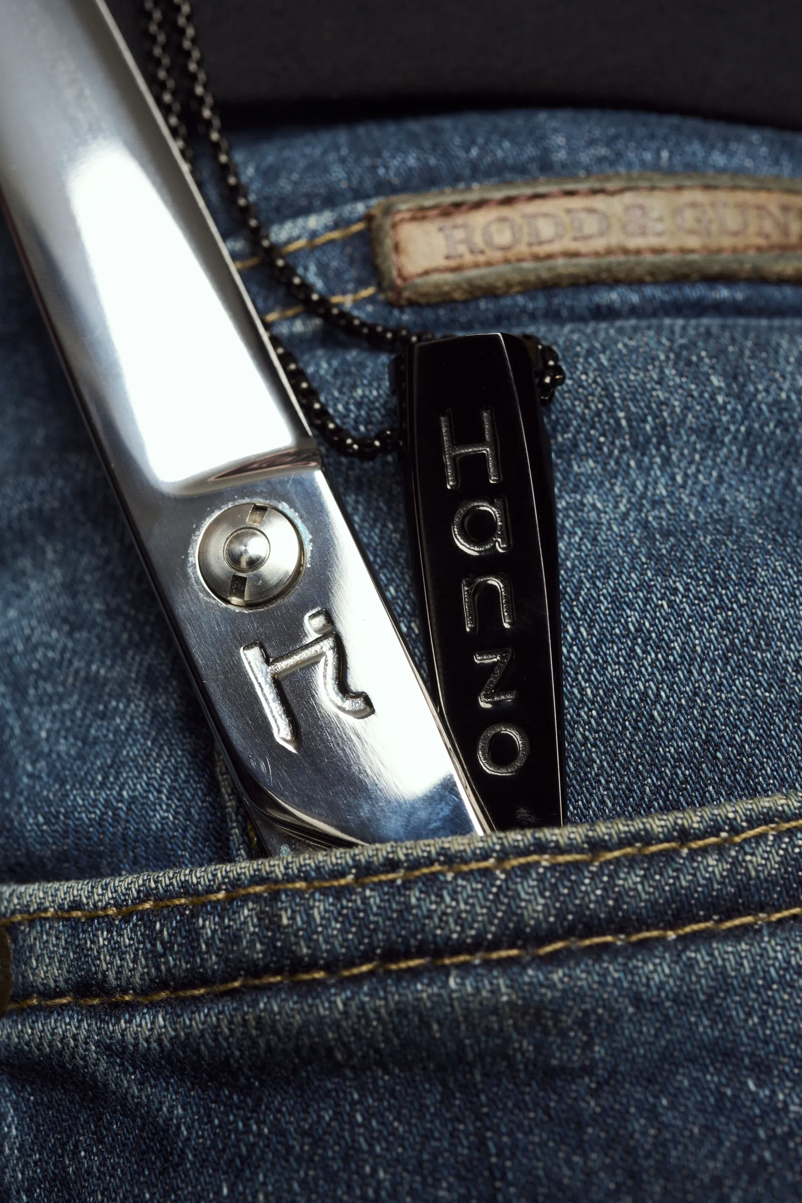 Hanzo shear and case tucked into a jeans pocket